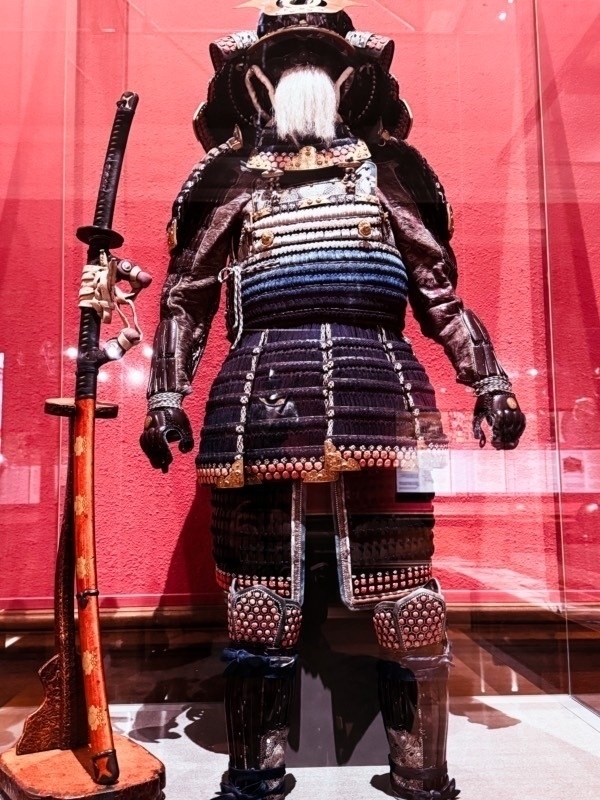 Ceremonial Samurai uniform inside a glass museum case. 